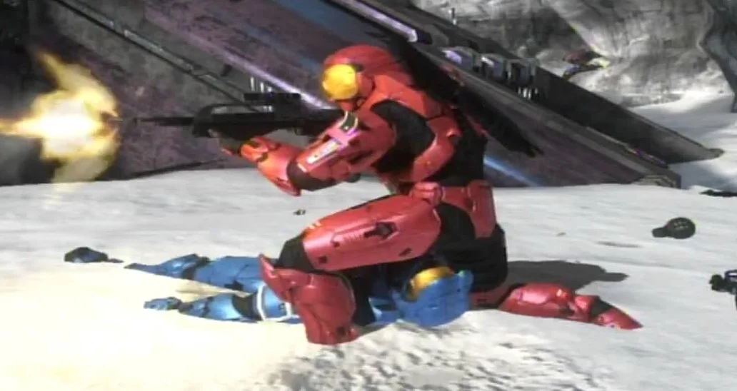 A red Spartan teabags a defeated blue Spartan in Halo, the multiplayer scenario that popularized the gesture in gaming culture.