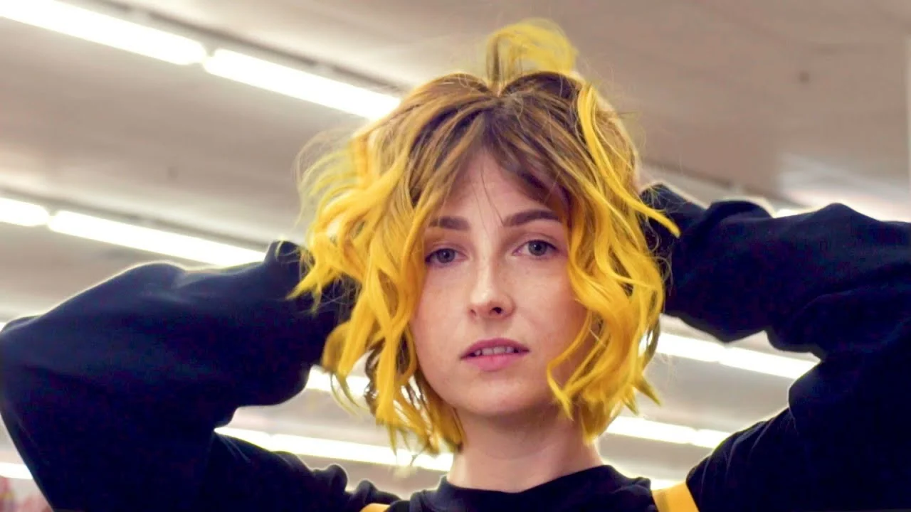The iconic still from Tessa Violet's 'Crush' music video that became the visual template for numerous Russian-language remixes and image macros.