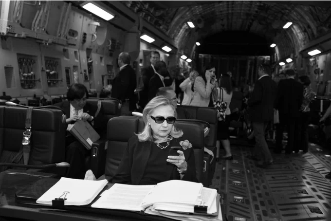 The full Diana Walker photograph taken aboard a C-17 flight to Tripoli, which became the visual foundation of the 'Texts from Hillary' Tumblr.