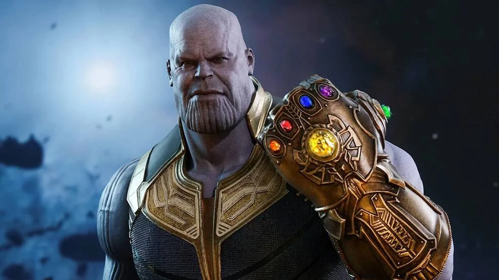 Thanos wielding the completed Infinity Gauntlet in a promotional image for Avengers: Infinity War.