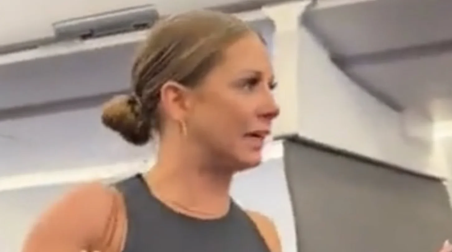 A close-up of Tiffany Gomas mid-rant during the July 2023 American Airlines incident that spawned the 'that motherfucker is not real' meme.