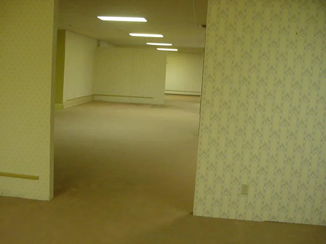 Iconic hallway: defining the Backrooms visual aesthetic.