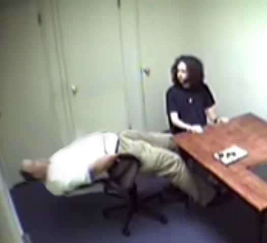 The original security camera still from Stephen McDaniel's 2011 police interrogation that became the basis for the meme.