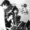 Grainy 1980s music studio photograph.