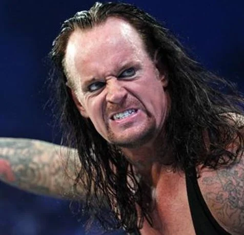 A signature menacing close-up of WWE's The Undertaker, the character whose decades-long career spawned numerous internet memes.