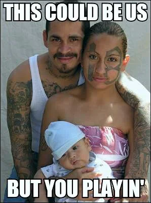 Tattooed couple with baby domestic scene.