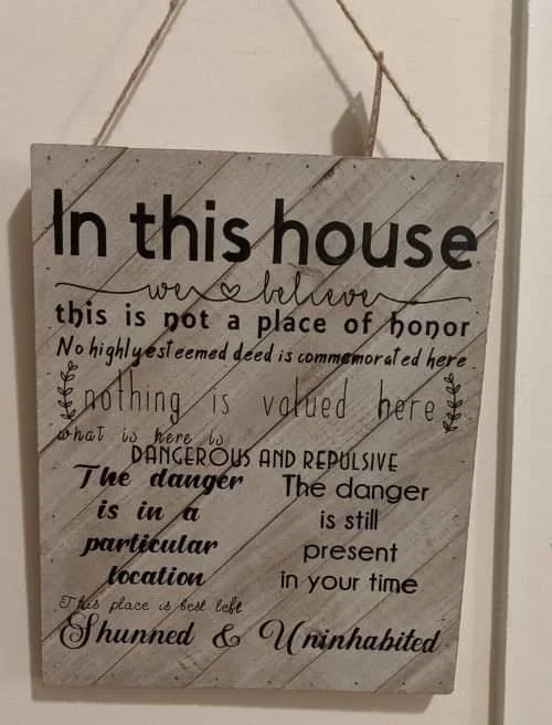 Home décor sign with apocalyptic warnings.