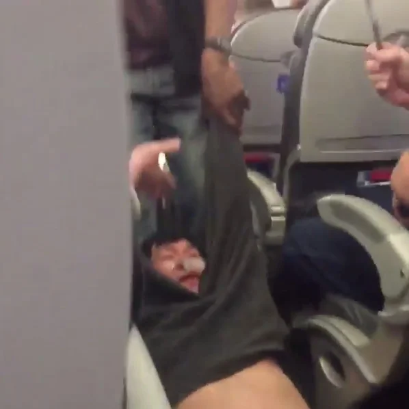 The viral cell phone photo of Dr. David Dao being forcibly removed from United Express Flight 3411 on April 9, 2017.