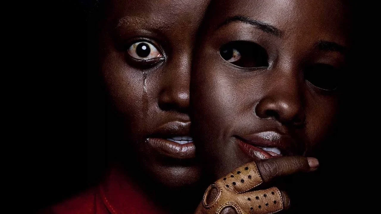 Promotional artwork for Jordan Peele's 2019 psychological horror film Us, featuring Lupita Nyong'o as Adelaide Wilson and her tethered doppelganger Red.