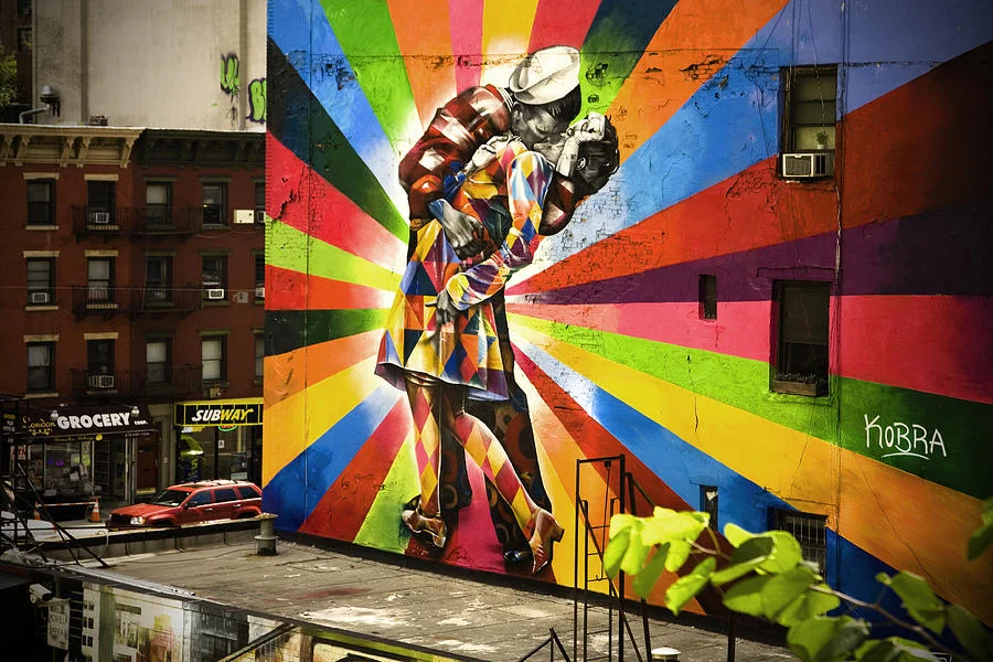 Eduardo Kobra's vibrant street mural in New York City reinterpreting the V-J Day kiss in his signature kaleidoscopic style.