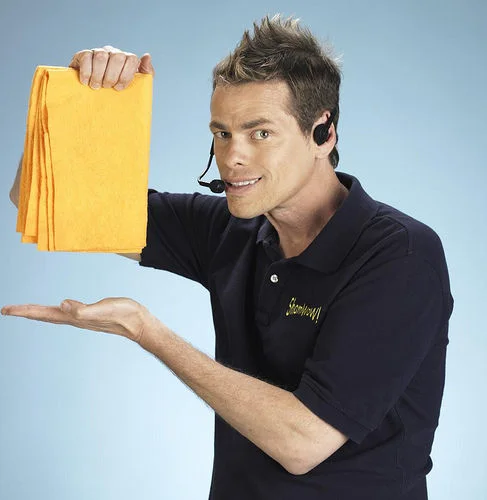 Infomercial pitchman Vince Offer (Vince Shlomi) posing with the orange ShamWow towels that made him a viral internet sensation.