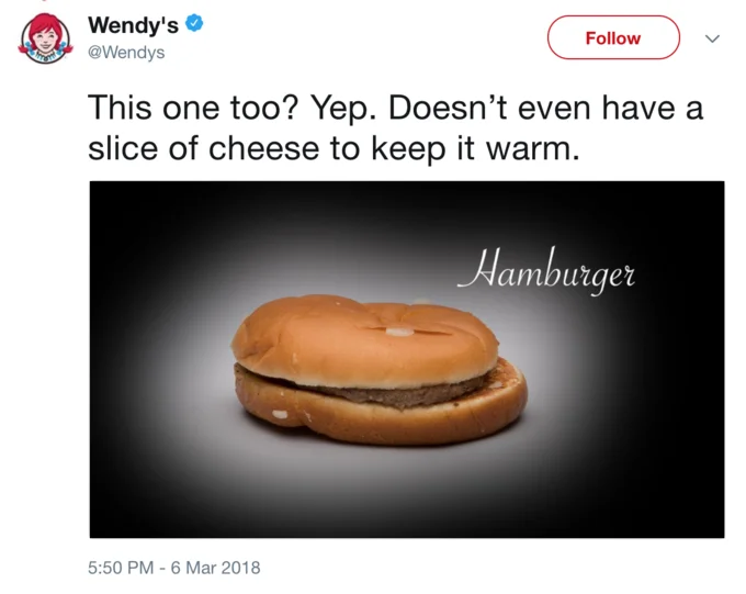 Wendy's extended its frozen beef roast to a plain McDonald's hamburger, joking that it lacked even cheese to warm it up.
