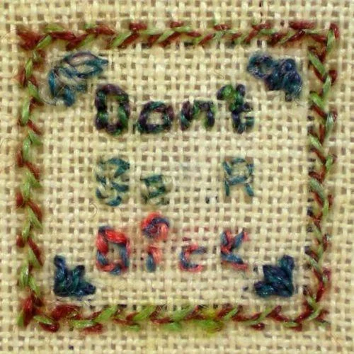 A hand-stitched embroidery rendering of Wheaton's Law in traditional sampler style.
