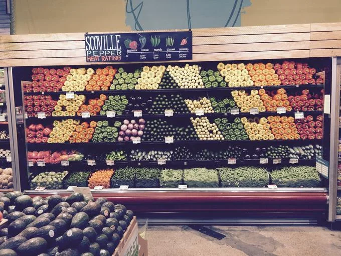 A Whole Foods produce display, often cited as emblematic of the chain's aesthetic and upscale presentation.