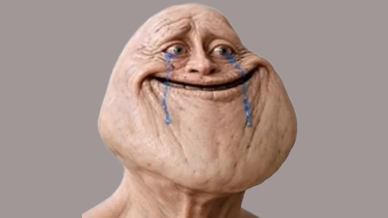 The original 'Why You Bulleh Meh' image featuring a smiling, wrinkled face with blue tears, used to convey forced cheerfulness in the face of mistreatment.