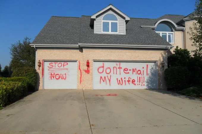 Vandalism on Cliff Nichols's home referencing the 'Don't email my wife' Cliff Wife Guy saga, one of the notable wife-guy scandals.