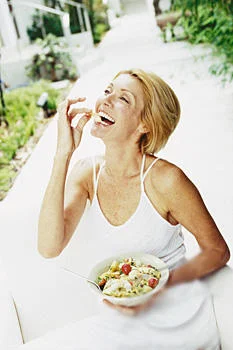 Women Laughing Alone With Salad