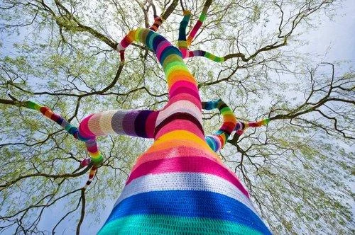 Rainbow-wrapped tree from below.