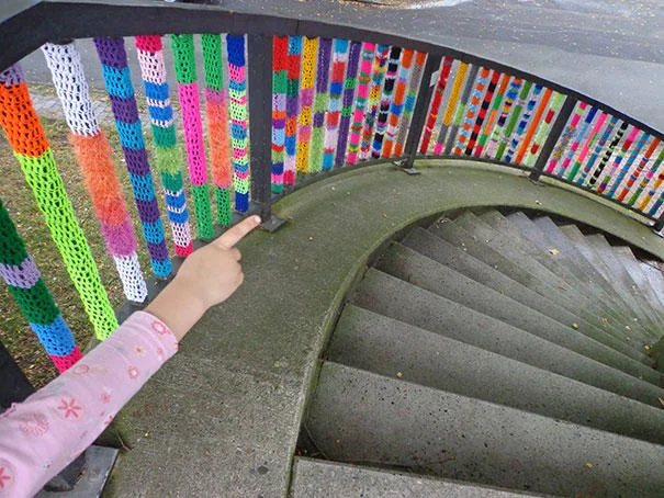 Colorful staircase railing installation.