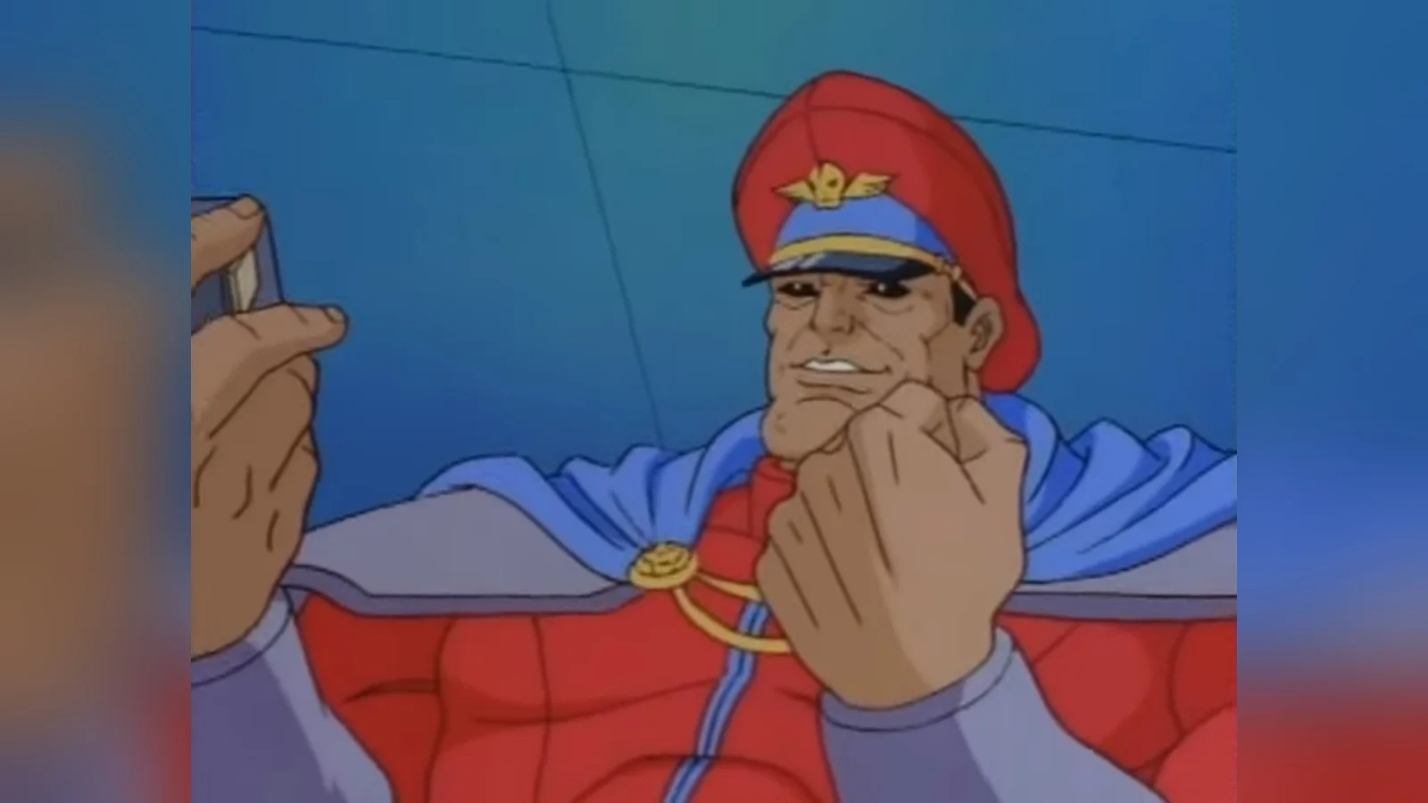 The original source frame of M. Bison from the Street Fighter animated series, the basis for the 'YES! YES!' reaction meme.