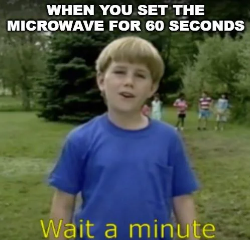 Popular 'Wait a minute' image macro using the Kazoo Kid to joke about setting a microwave for 60 seconds.