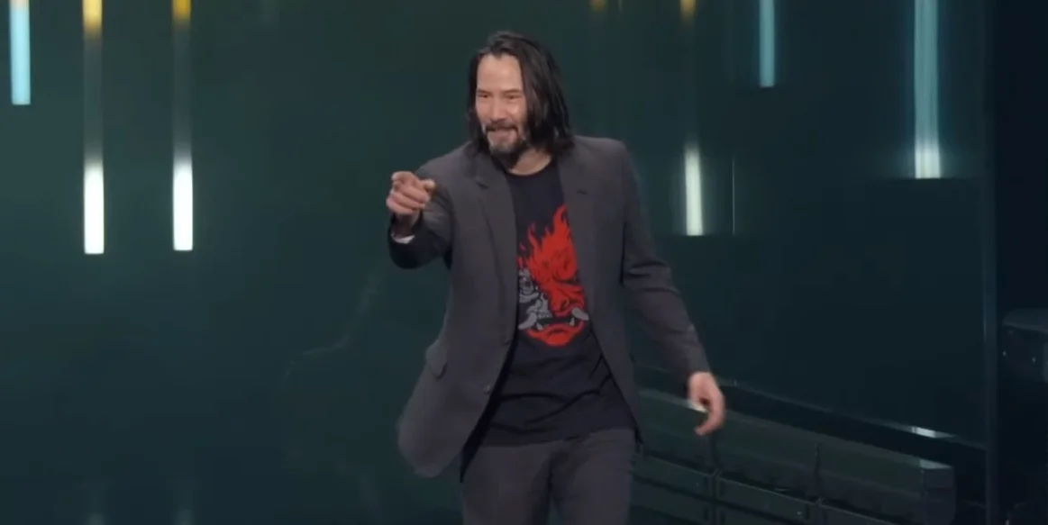 Keanu Reeves points to a fan during his Cyberpunk 2077 reveal at E3 2019, the moment that produced the 'You're Breathtaking!' catchphrase.