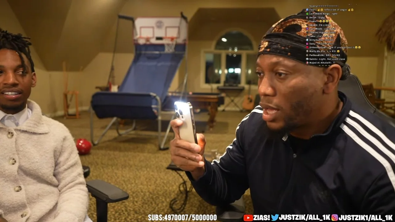 A still from the Zias and Blou livestream in which the duo attempt to test whether sound or light is faster, with live-chat viewers reacting in real time.